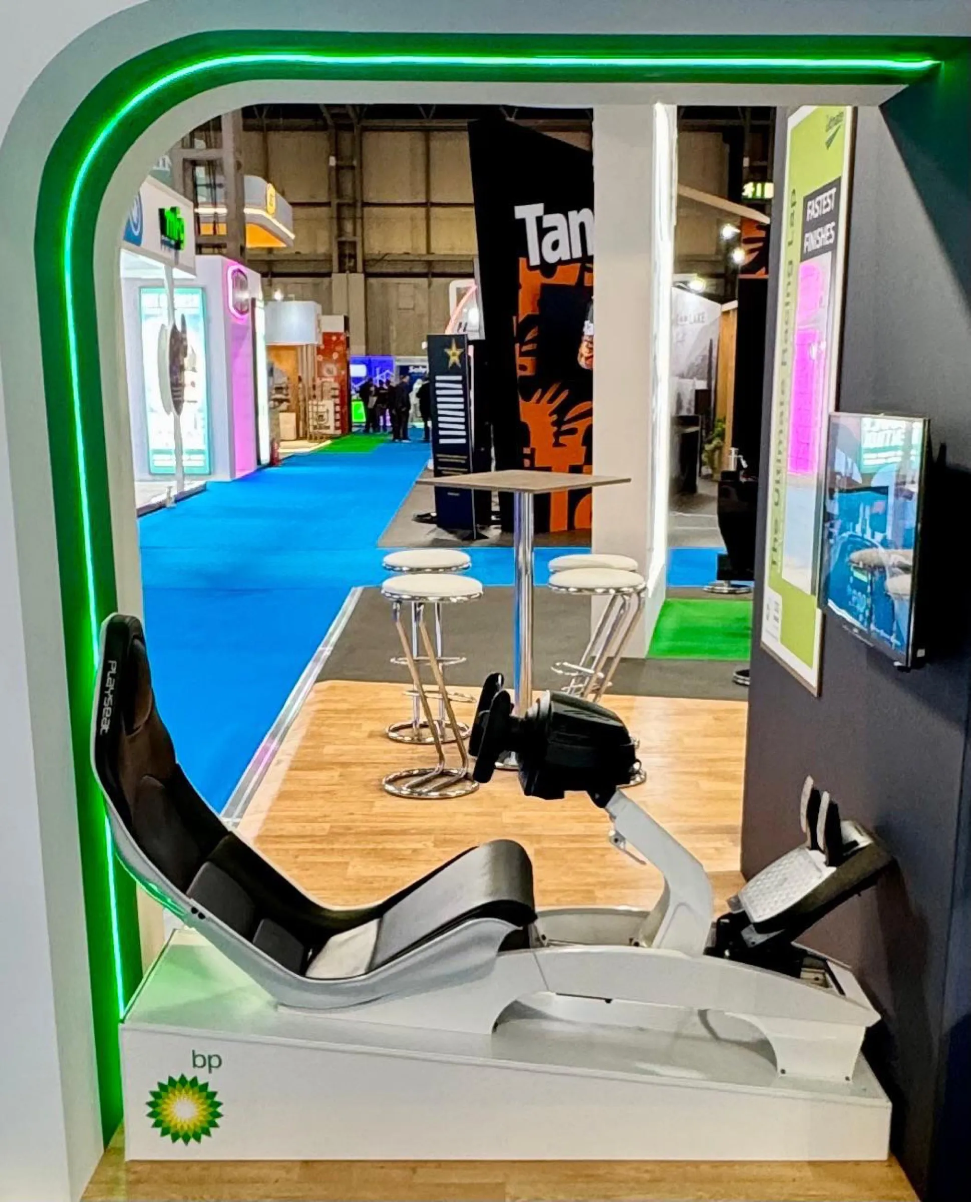 Racing simulator pod branded in BP Ultimate green and yellow