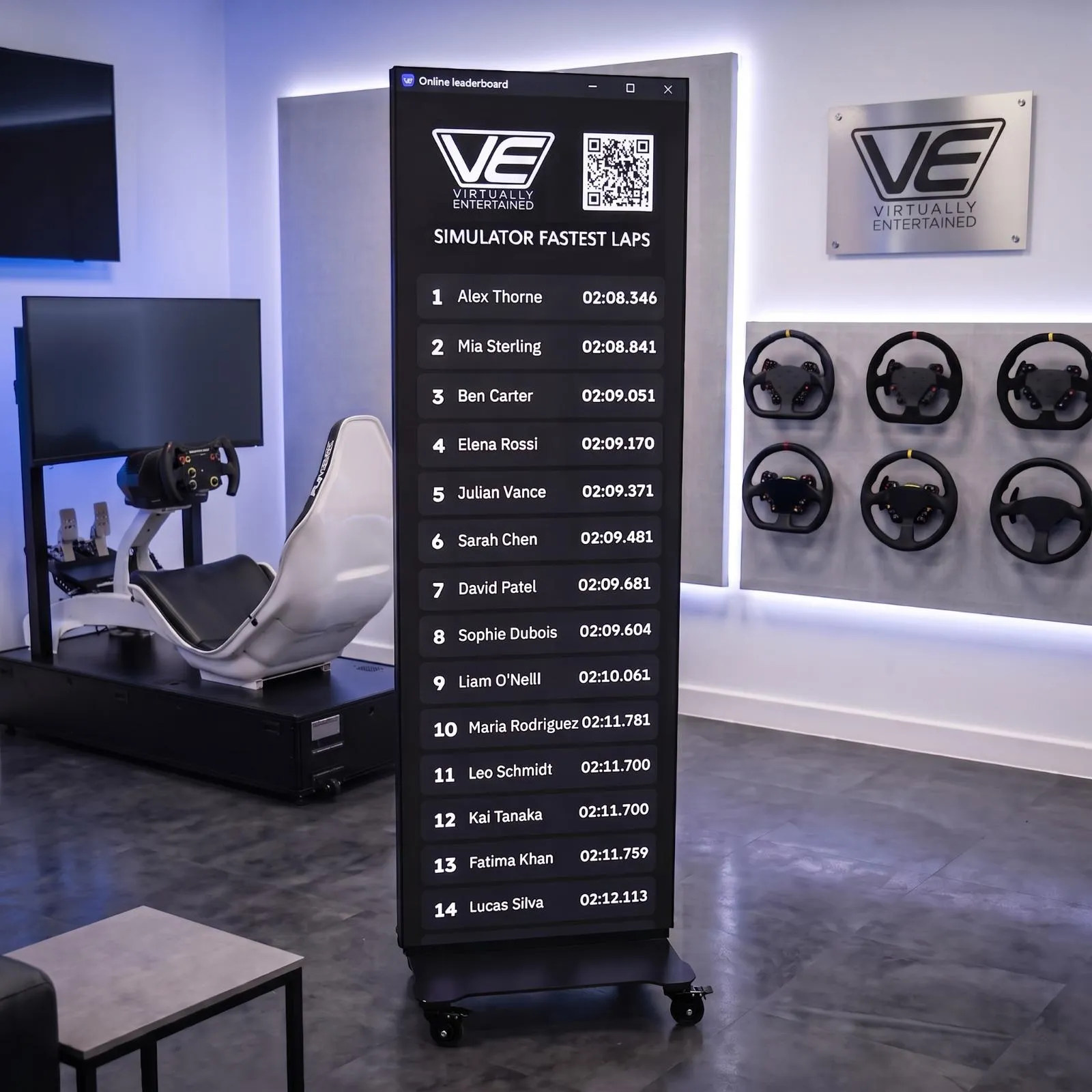 Tall freestanding digital leaderboard showing the fastest laps beside a racing simulator in the Virtually Entertained showroom