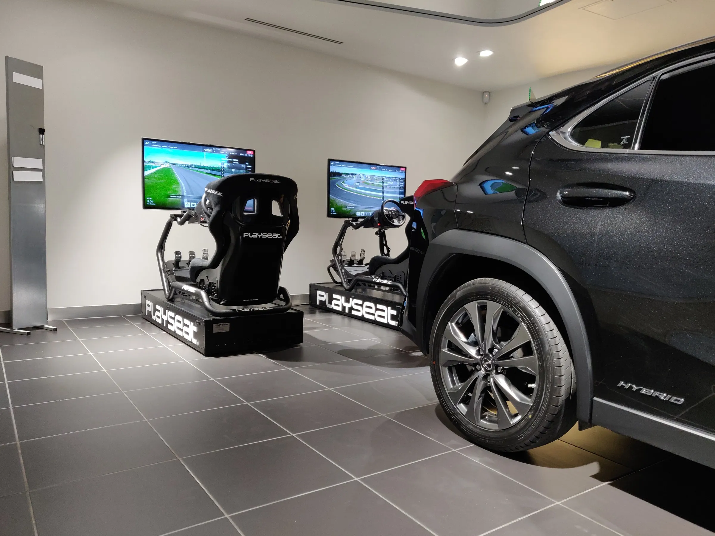 GT racing simulators set up in a showroom