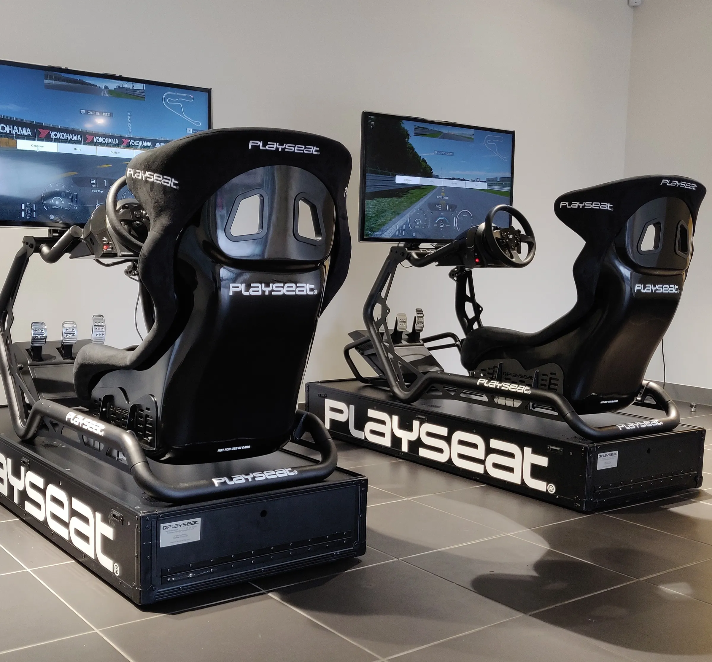 Two black racing simulators built and ready at the Virtually Entertained base near Silverstone